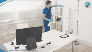 Commercial Cleaning Sydney staff wiping desks and surfaces in a corporate office.